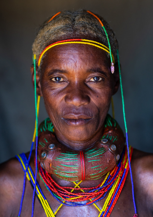 Mungambue tribe woman with the traditional hairtsyle and necklace, Huila Province, Chibia, Angola