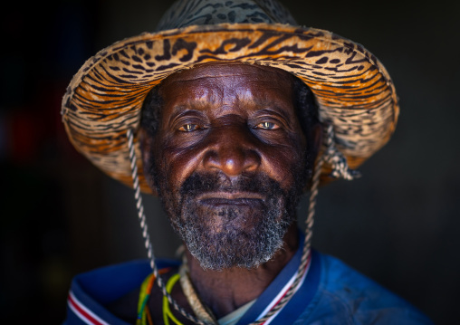 Mungambue tribe man wearing a hat, Huila Province, Chibia, Angola