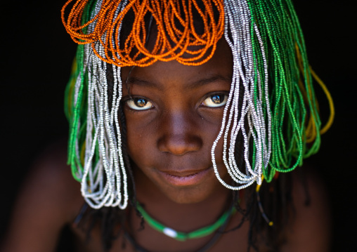 Muhakaona tribe girl with a beaded wig used for the fico ceremony, Cunene Province, Oncocua, Angola