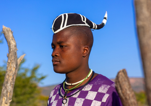 Himba tribe man with a special hairstyle which shows he is single, Cunene Province, Oncocua, Angola
