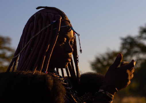 Himba tribe woman face in the sun, Cunene Province, Oncocua, Angola