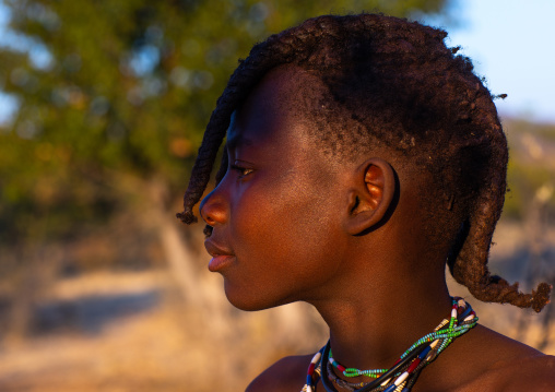 Side view of an himba tribe girl portrait, Cunene Province, Oncocua, Angola