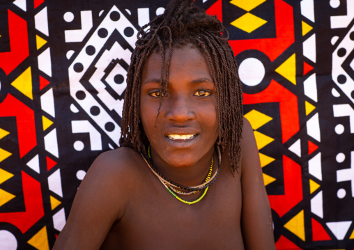 Smiling batwa tribe young woman who will soon be married, Cunene Province, Oncocua, Angola