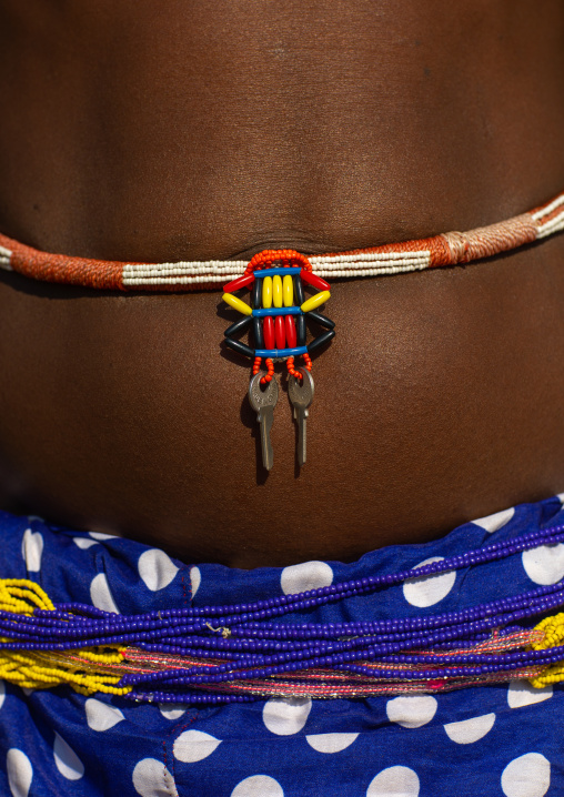 Mudimba tribe woman wearing her keys on a belt, Cunene Province, Cahama, Angola