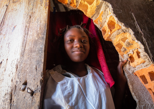 Angolan girl living in an experimental house for the local people built by the portuguese, Namibe Province, Caraculo, Angola