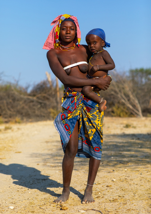 Mucubal tribe woman with her child suffering of intellectual disability, Namibe Province, Virei, Angola