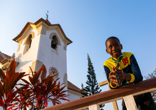 Angolan boy in front of igreja da arrábida, Benguela Province, Lobito, Angola