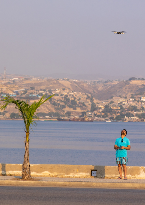 European tourist controling his Mavic drone, Benguela Province, Lobito, Angola