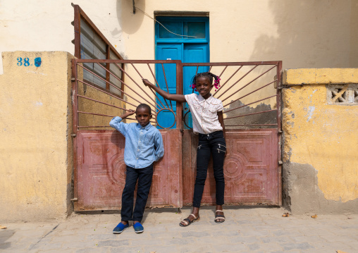 Children in front of a portuguese colonial house, Benguela Province, Catumbela, Angola