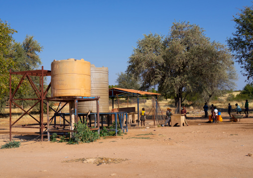 Angolan children collecting water in a well, Cunene Province, Oncocua, Angola