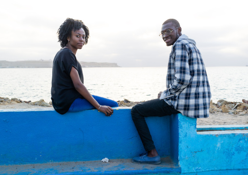 Angolan couple having a chat in miragens beach, Namibe Province, Namibe, Angola