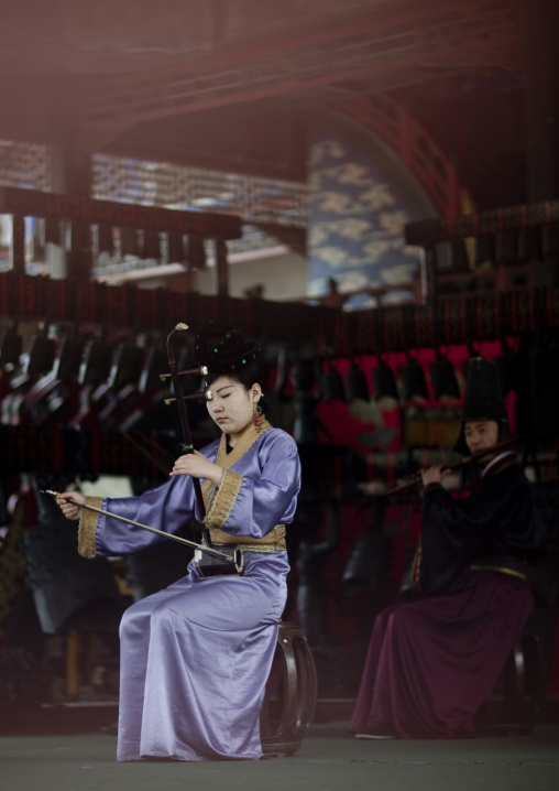 Woman Playing Traditional Chinese Stringed Instrument, Beijing, China