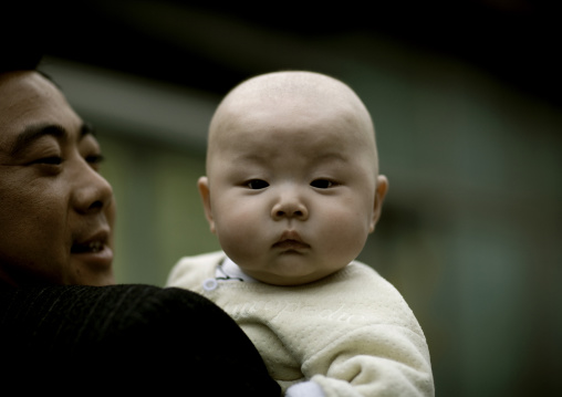 Father Holding His Moon Face Baby, Beijing China