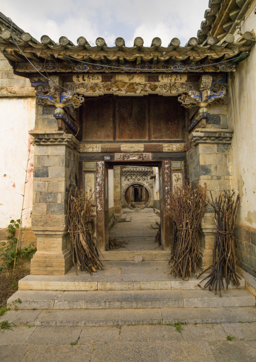 Old Chinese traditional gate At Tuan Shan Village, Yunnan Province, China