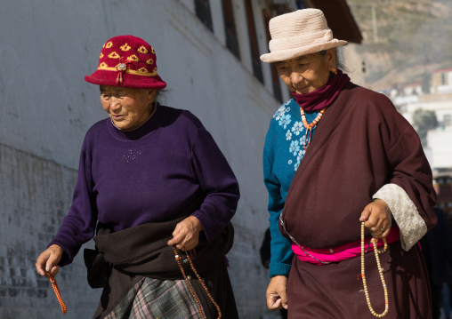 tibetan women walking the kora in Rongwo monastery, Tongren County, Longwu, China