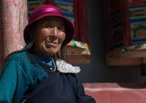 Tibetan pilgrim woman in Rongwo monastery, Tongren County, Longwu, China