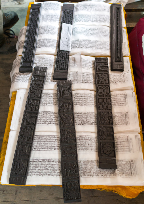 Tibetan scriptures printed from wooden blocks in the monastery traditional printing temple, Gansu province, Labrang, China