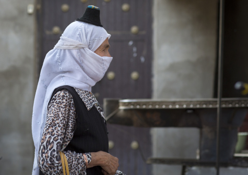 Uyghur Woman Wearing The Smallest Hat In The World, Keriya, Xinjiang Uyghur Autonomous Region, China