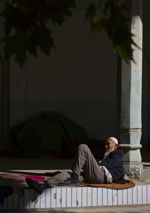 Old Uyghur Man Resting Outside The Mosque, Yarkand, Xinjiang Uyghur Autonomous Region, China