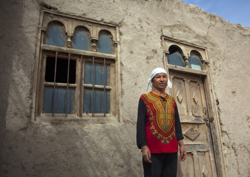 Uyghur Cotton Producer In Front Of A House, Hotan, Xinjiang Uyghur Autonomous Region, China
