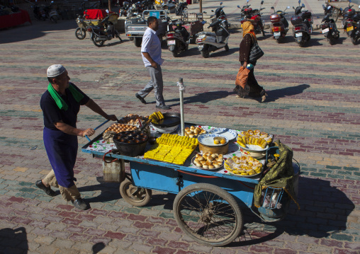 Uyghur Man Pulling A Mobile Food Stall, Yarkand, Xinjiang Uyghur Autonomous Region, China
