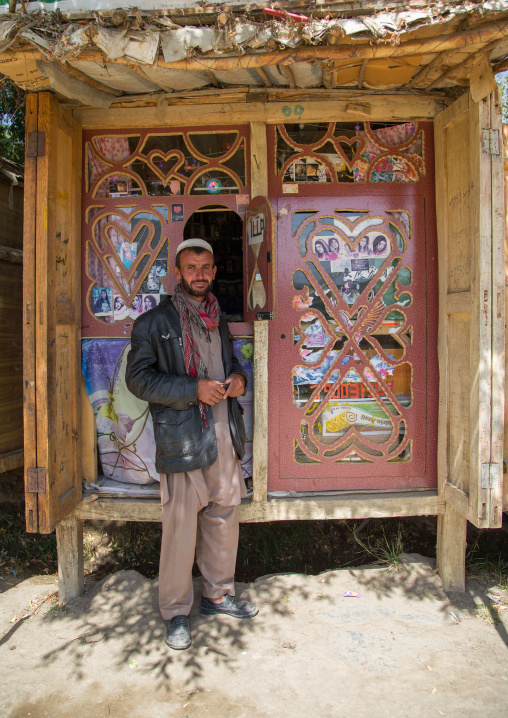 Afganh man selling music and dvd in the market, Badakhshan province, Ishkashim, Afghanistan