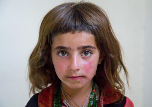 Portrait of an afghan girl with red cheecks, Badakhshan province, Khandood, Afghanistan