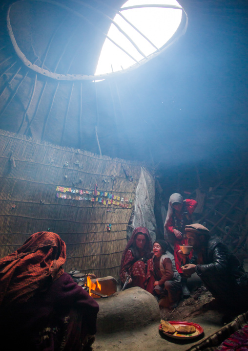 Wakhi nomad family eating breakfast inside their yurt, Big pamir, Wakhan, Afghanistan