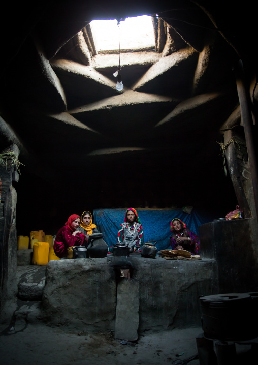 Afghan family inside their traditional pamiri house, Badakhshan province, Khandood, Afghanistan