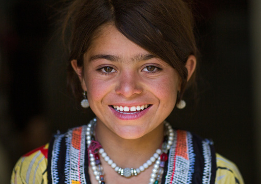 Smiling afghan girl in traditional clothing, Badakhshan province, Wuzed, Afghanistan