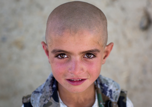 Afghan boy with head shaved, Badakhshan province, Khandood, Afghanistan