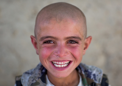 Smiling afghan boy with head shaved, Badakhshan province, Khandood, Afghanistan