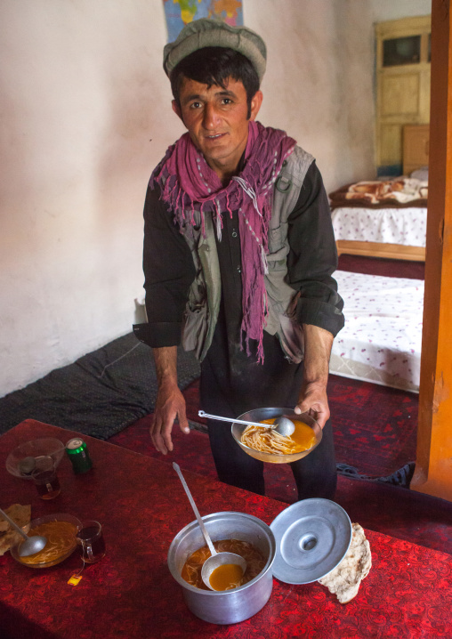 Afghan Man Serving Food In A Pamiri Traditional Guest House, Badakhshan Province, Khandood, Afghanistan