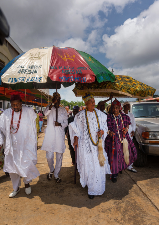 Benin, West Africa, Porto-Novo, traditional beninese king alajase onikoyi abessan king walking under an umbrella