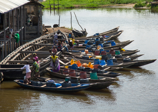 Benin, West Africa, Ganvié, boats queueing to collect fresh water on lake nokoue