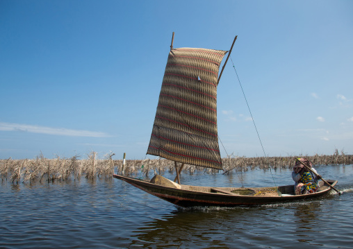 Benin, West Africa, Ganvié, boat sailing on lake nokoue