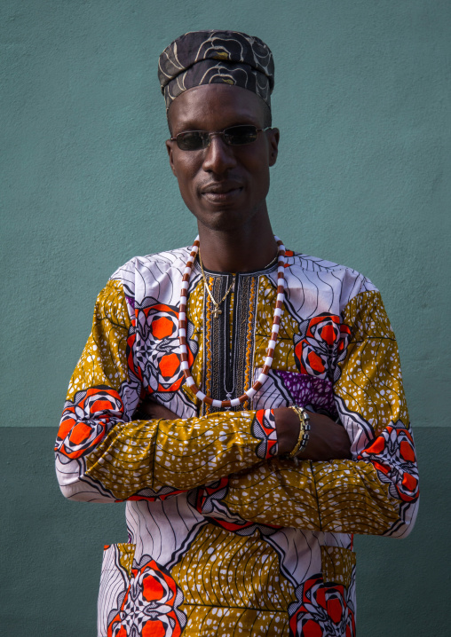 Benin, West Africa, Ganvié, fashionable blind young man with arms crossed