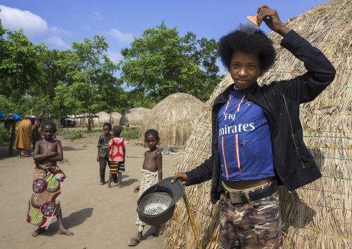 Benin, West Africa, Gossoue, young fulani peul man with fashionable clothes and afro hair