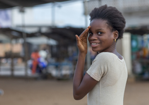 Benin, West Africa, Porto-Novo, portrait of a shy beninese girl in the street