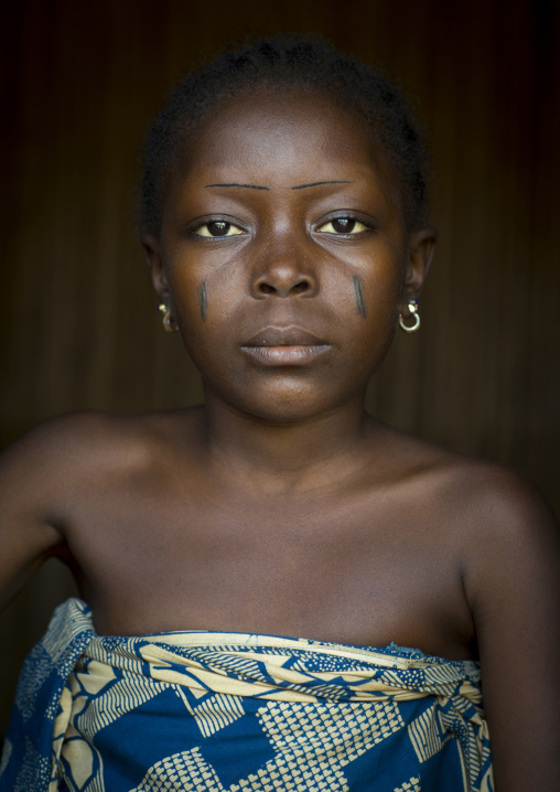 Benin, West Africa, Onigbolo Isaba, holi tribe girl with traditional facial tattoos and scars