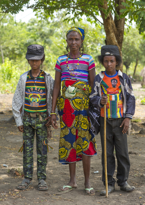 Benin, West Africa, Gossoue, a fulani peul mother with her two sons dressed in fashionable clothes