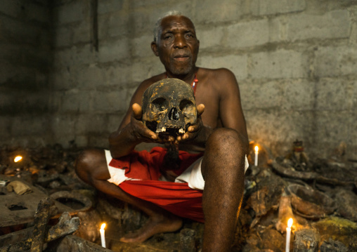 Benin, West Africa, Bopa, dah tofa voodoo master showing the skulls criminals killed by heviosso the god of thunder that he collects