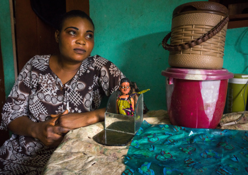 Benin, West Africa, Ouidah, tatiana takes cares of the carved wooden figure of her daughter paterna