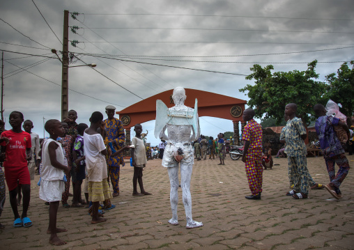 Benin, West Africa, Savalou, man disguised as an angel collecting money in the street
