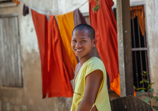 Young smiling monk in a monastery, Battambang province, Battambang, Cambodia