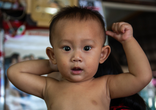 Portrait of a shirtless cambodian boy, Battambang province, Battambang, Cambodia