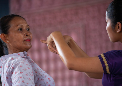 Cambodian dancer with her teacher during a training session of the National ballet, Phnom Penh province, Phnom Penh, Cambodia
