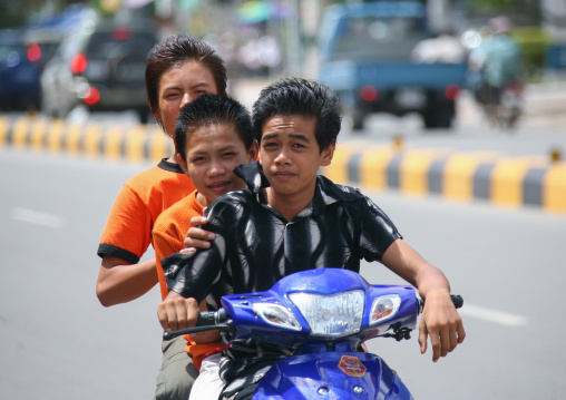 A group of children going on a motorcycle ride, Phnom Penh province, Phnom Penh, Cambodia