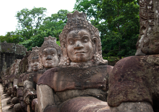 Sculptures at the way of Angkor wat entrance gate, Siem Reap Province, Angkor, Cambodia