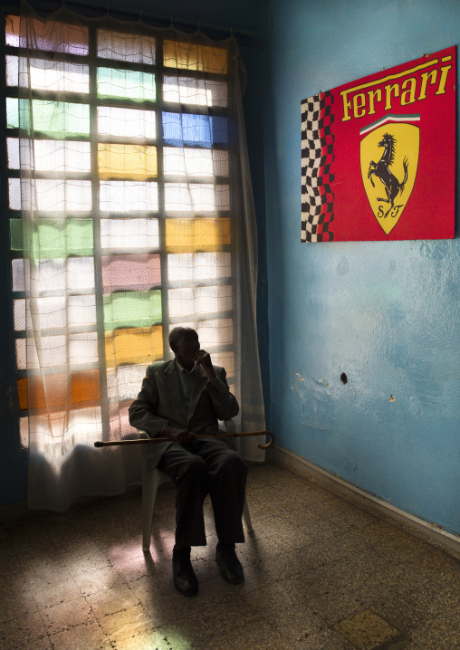 Old Man In Front Of Ferrari Poster In Asmara Swimming Pool, Eritrea